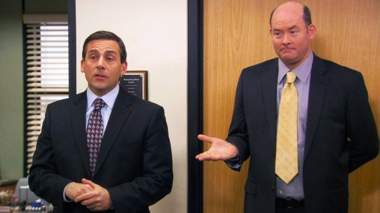 Steve Carrell and David Koechner as Michael Scott and Todd Packer, standing together on The Office