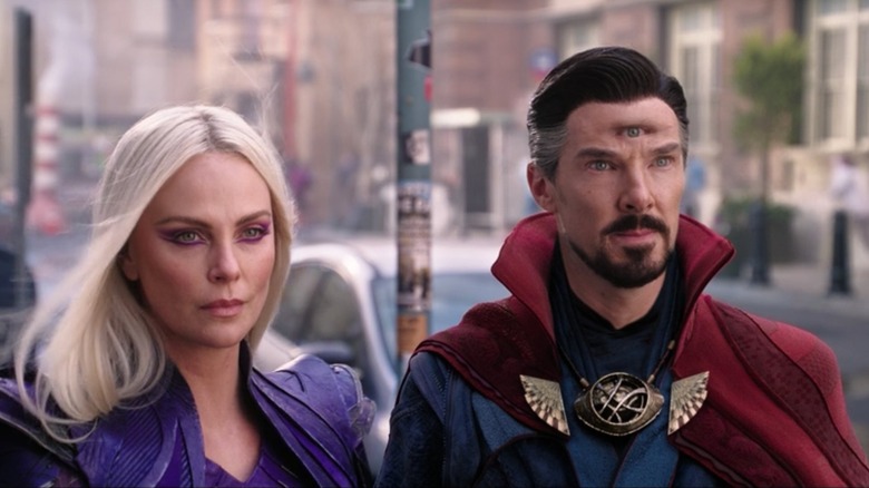 Clea (Charlize Theron) stands next to Doctor Strange (Benedict Cumberbatch) in Doctor Strange in the Multiverse of Madness