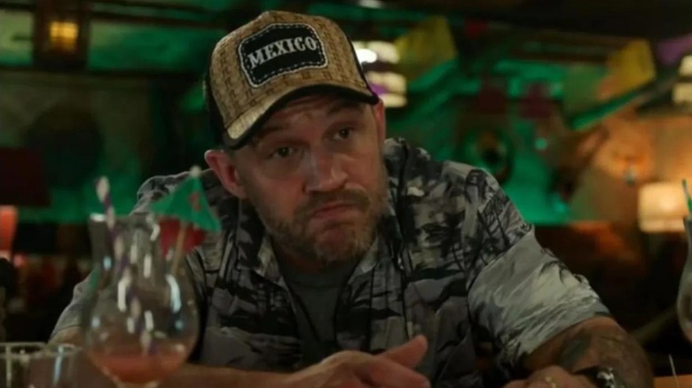 Eddie Brock (Tom Hardy) sits dejectedly at a bar in Spider-Man: No Way Home