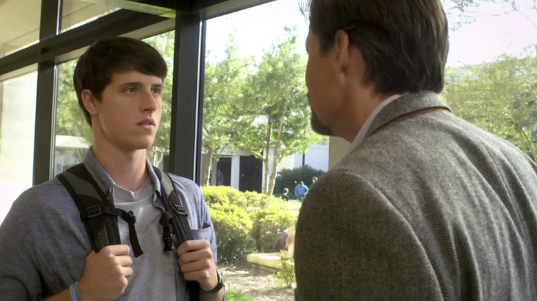 Shane Harper as Josh Wheaton and Kevin Sorbo as Professor Jeffrey Radisson in God's Not Dead, locked in conversation together outside on a college campus.