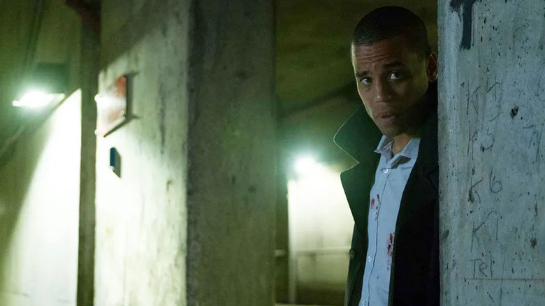 Jacob Singer (Michael Ealy) peering down a hallway in 2019's Jacob's Ladder