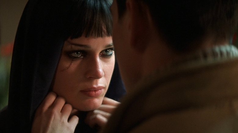 Aurora (Rebecca Romijn) talking to Johnathan (Chris Klein) in 2002's Rollerball