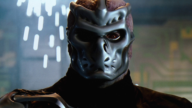 A cybernetically enhanced Jason Voorhees (Kane Hodder) stands intimidatingly in Jason X