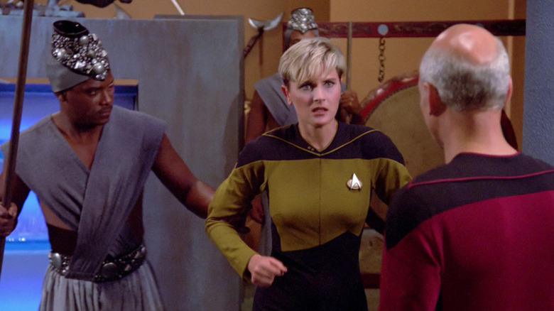 Tasha Yar (Denise Crosby) is taken forcibly in front of Jean-Luc Picard (Patrick Stewart) in Star Trek: The Next Generation