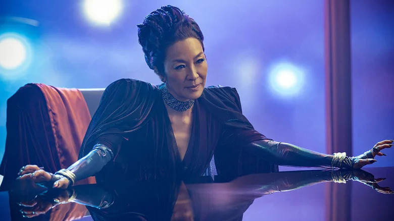 An elegantly dressed Philippa Georgiou (Michelle Yeoh) sits at a table in Star Trek: Section 31