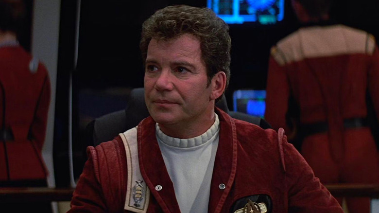 A dissatisfied Jim Kirk (William Shatner) sits in the captain's chair in Star Trek V: The Final Frontier