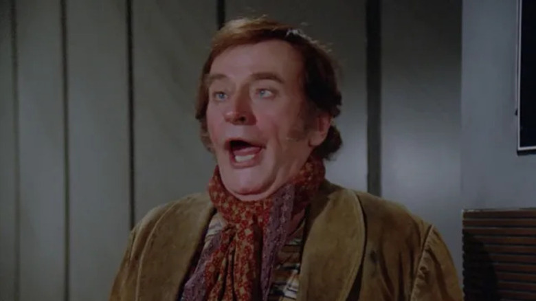 A drunk Danilo Odell (Barrie Ingham) belches in Star Trek: The Next Generation