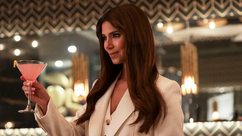 Roselyn Sánchez as Elena Roarke, raising a glass on the 2021 revival of Fantasy Island.