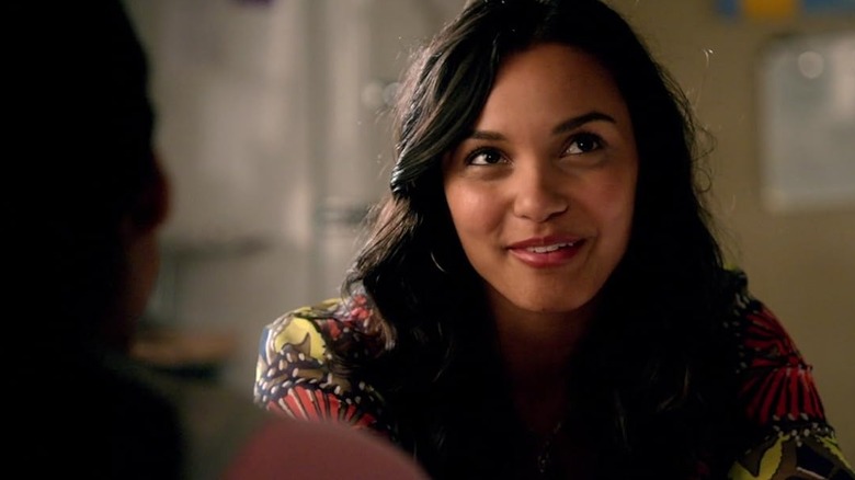 Jessica Lucas as Riley Richmond, smiling and looking up in the 2009 revival of Melrose Place,