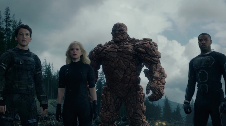 Reed, Sue, Ben, and Johnny looking over a cliff in Fantastic Four (2015)