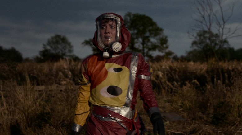 Michelle in a hazmat suit in 10 Cloverfield Lane