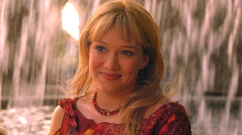 Lizzie McGuire Movie: Lizzie smiling in front of waterfall