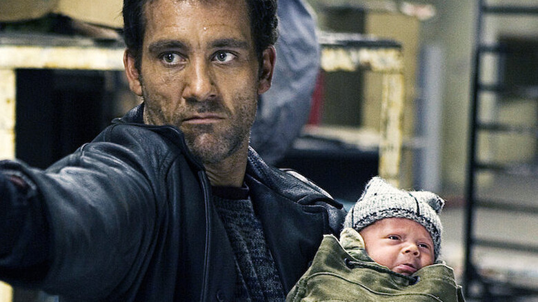Clive Owen Holds Baby