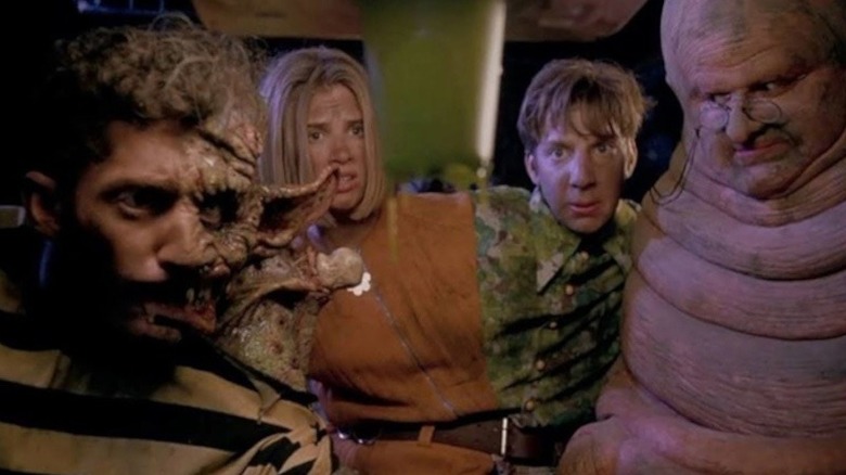 Alex Winter with half of his face mutated, Megan Ward and Michael Stoyanov attached like conjoined twins, and Derek McGrath playing a man who looks like a worm in Freaked