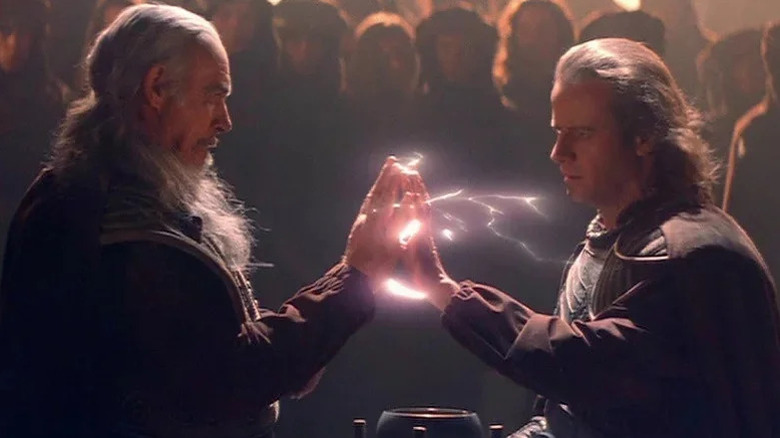 Sean Connery with long grey hair as Ramirez and Christopher Lambert as Connor touching hands with electricity between them in Highlander 2: The Quickening