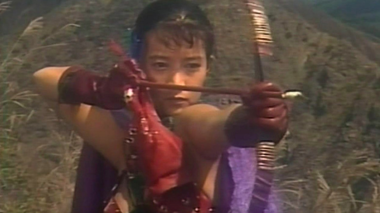 Miyuki Katori as Panty Mask, wearing red gloves in red bikini and shooting arrow in Legendary Panty Mask