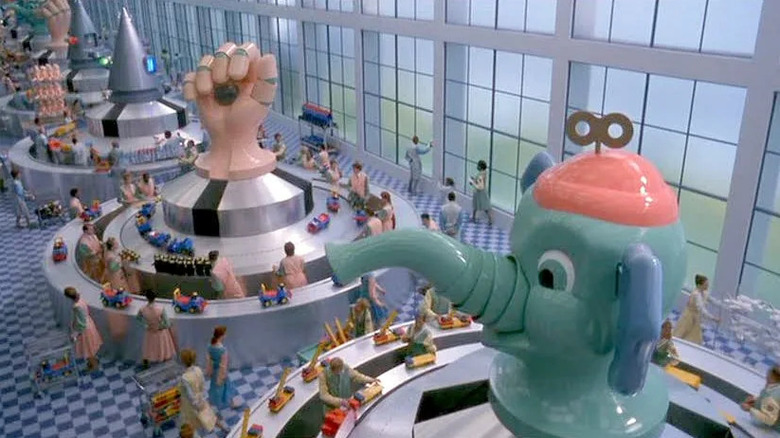 Enormous toy factory with round metal stations topped with a giant hand an an elephant in Toys