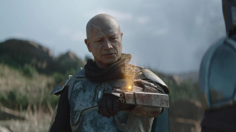 Temuera Morrison as Boba Fett proves his claim to the Mandalorian armor in The Mandalorian