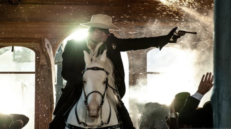 The Lone Ranger (Armie Hammer) rides a horse in The Lone Ranger