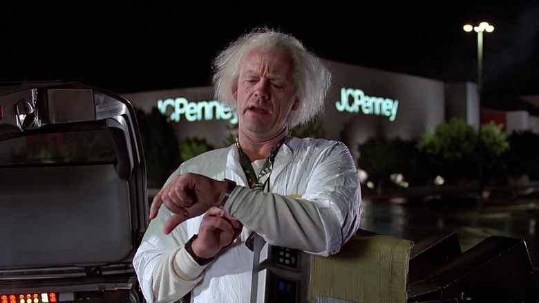 Christopher Lloyd's Doc Brown checking his watch in Back to the Future