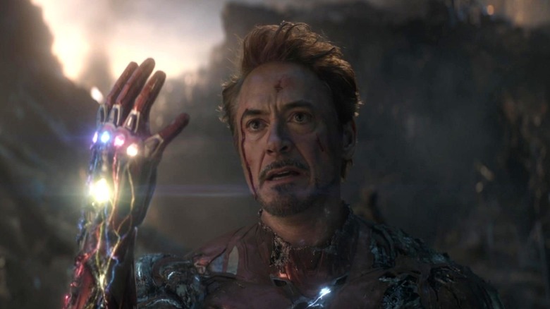 Robert Downey Jr.'s Iron Man holding the Infinity Stones in Avengers: Endgame