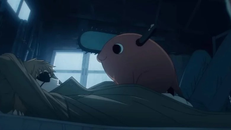 pig with chainsaw on bed