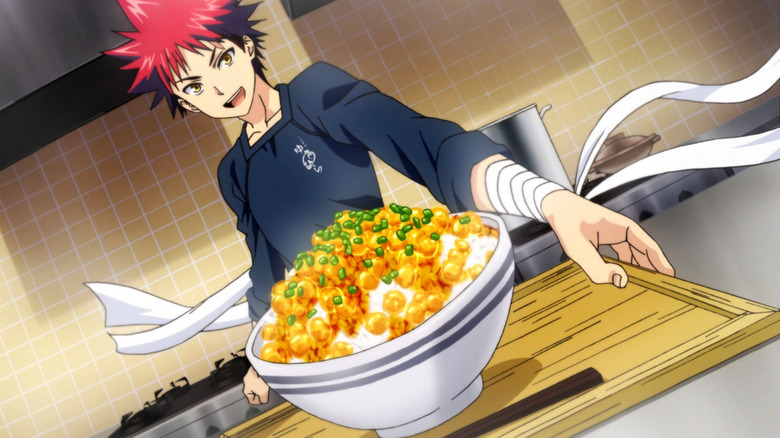 Soma Yukihira displays a boil of rice with golden and green toppings in Food Wars!: Shokugeki no Soma