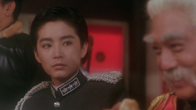 Brigitte Lin as Tsao and Kenneth Tsang as her father, facing a divide in Peking Opera Blues