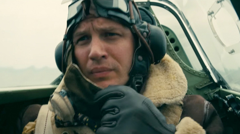 Farrier (Tom Hardy) takes off his mask in his cockpit in Dunkirk