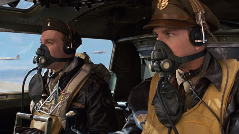 Luke Sinclair (Tate Donovan) and Dennis Dearborn (Matthew Modine) sit in the cockpit of a flying B-17 in Memphis Belle