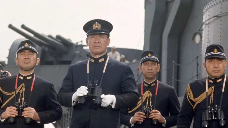 Isoroku Yamamoto (Sō Yamamura) stands with a trio of Japanese officers holding binoculars on a battleship deck in Tora! Tora! Tora!