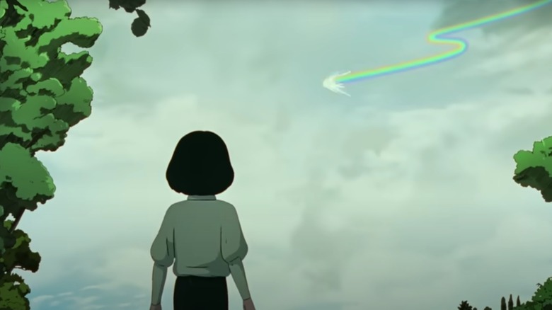 Margot Ringard Oldra's Iris looking at a mysterious rainbow in the sky in Arco