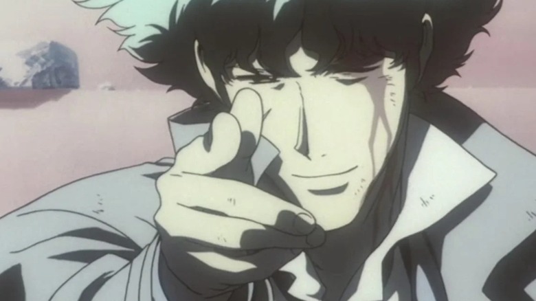 A bleeding Spike Spiegel aims a finger gun while smiling in Cowboy Bebop