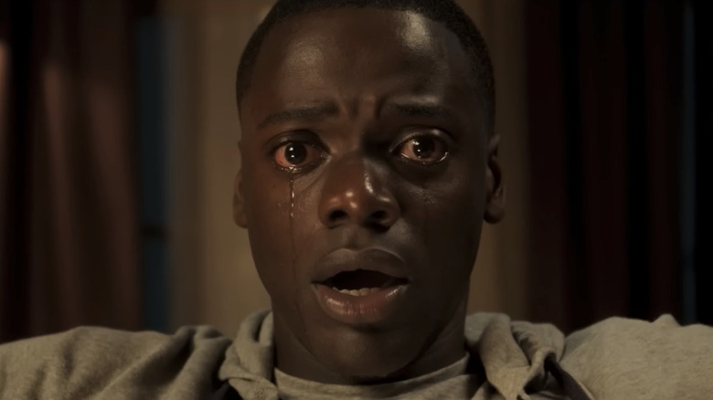 Daniel Kaluuya as Chris, crying and frozen in Get Out