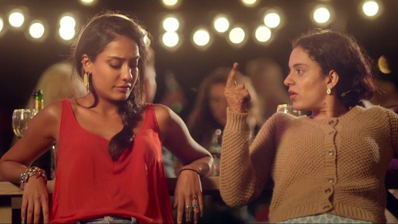Lisa Haydon as Vijayalakshmi sitting next to Kangana Ranaut as Rani in Queen