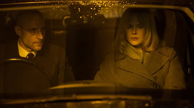 Mike Nasch (Mark Strong) and Christine Lucas (Nicole Kidman) sit together in a car in the rain in Before I Go to Sleep
