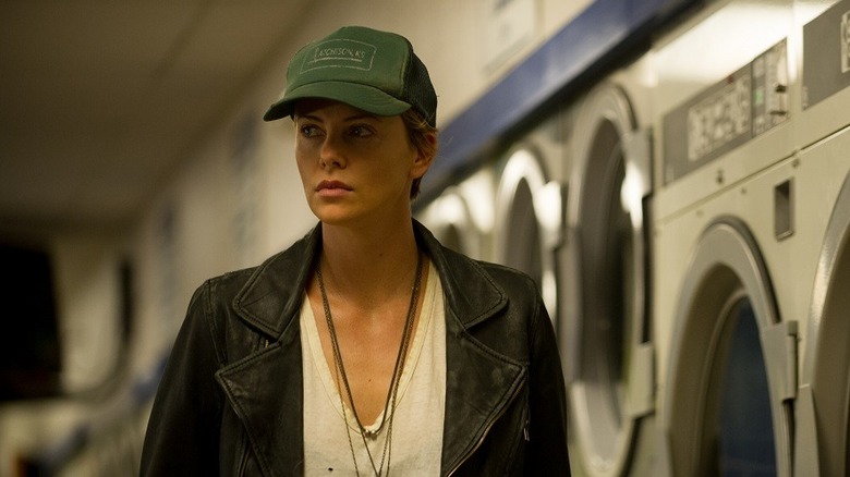 Libby Day (Charlize Theron) stands in a laundromat in Dark Places