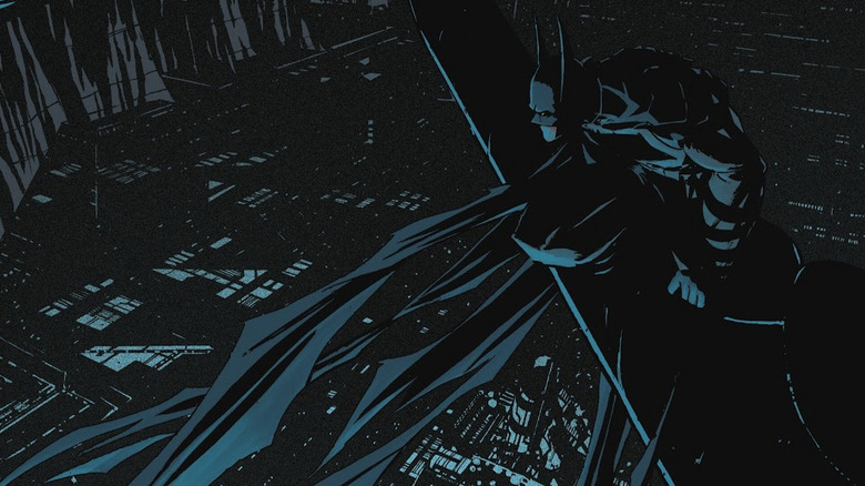 Batman looms over the massive underground city of Ark M.