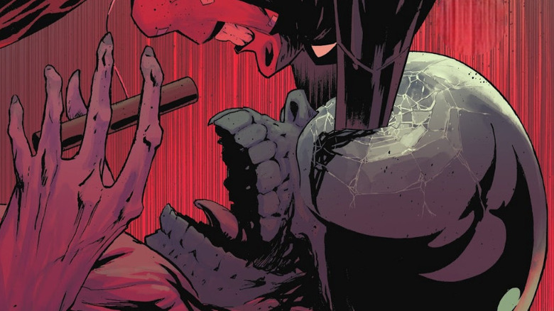 Batman plunges his razor sharp ears into the eyes of Black Mask