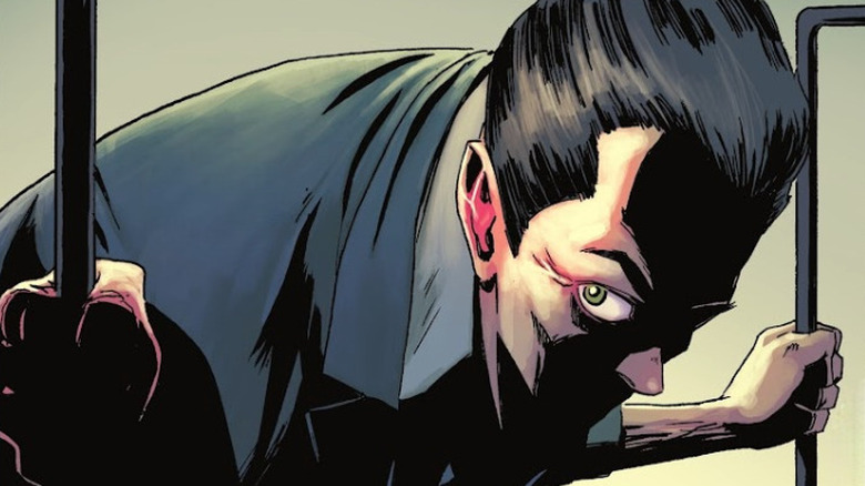 A man with his face obscured, identified as The Joker, steps into a helicopter