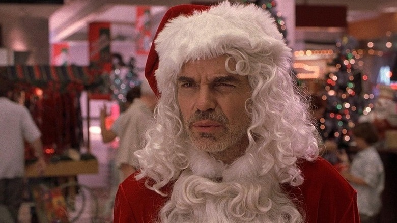 Willie T. Soke (Billy Bob Thornton) stands incredulously dressed as Santa Claus in a mall in Bad Santa