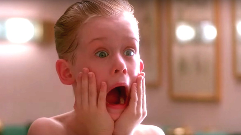 Kevin McAllister (Macaulay Culkin) clasps his face and screams in Home Alone