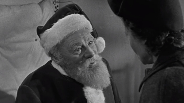 Kris Kringle (Edmund Gwenn) stares at a woman in Miracle on 34th Street (1947)