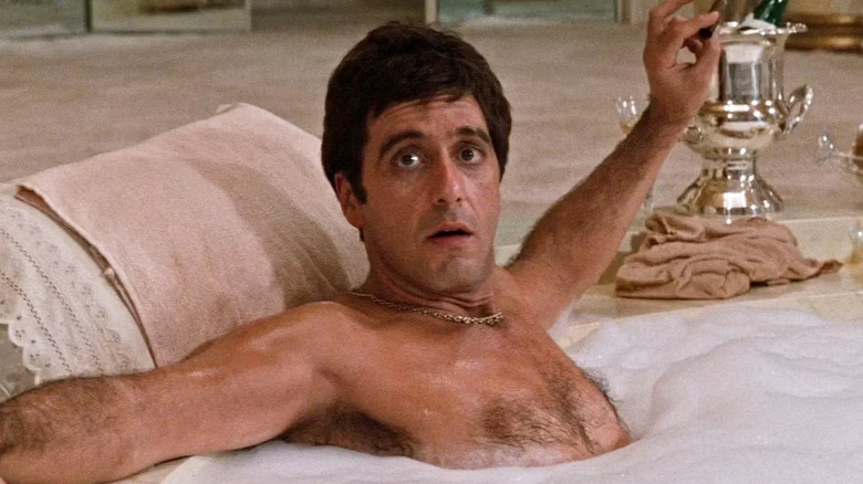 Al Pacino as Tony Montana sitting in a luxurious hot tub in Scarface