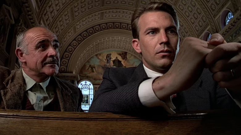 Sean Connery and Kevin Costner as Jimmy Malone and Eliot Ness, sitting together in a church in The Untouchables