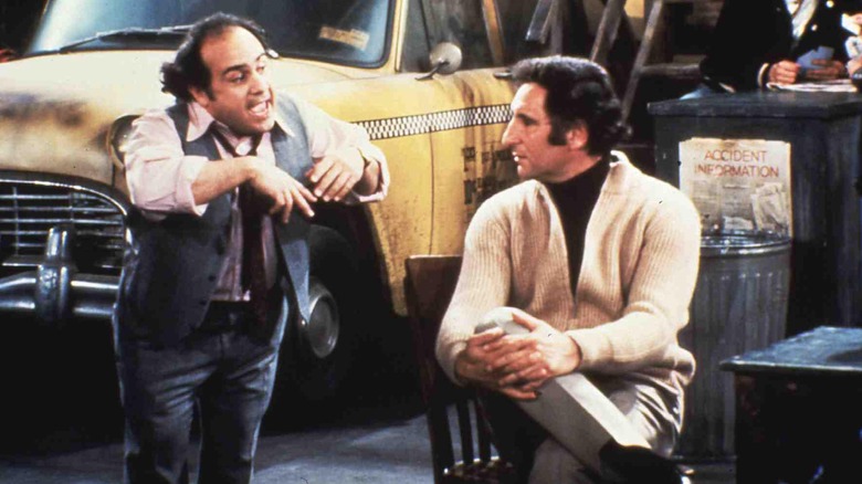 Louie (Danny DeVito) and Alex Reiger (Judd Hirsch) talking in Taxi