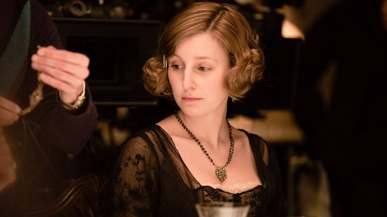 Edith Crawley (Laura Carmichael) sits demurely in Downton Abbey