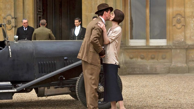 Henry Talbot (Matthew Goode) kisses Mary Crawley (Michelle Dockery) by his car in Downton Abbey