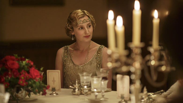 Edith Crawley (Laura Carmichael) sits at a lavish dinner in Downton Abbey