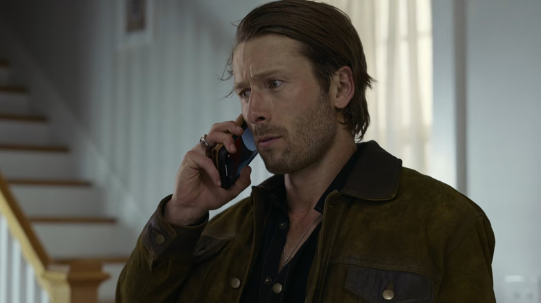 Gary (Glen Powell) stressed on phone in Hit Man